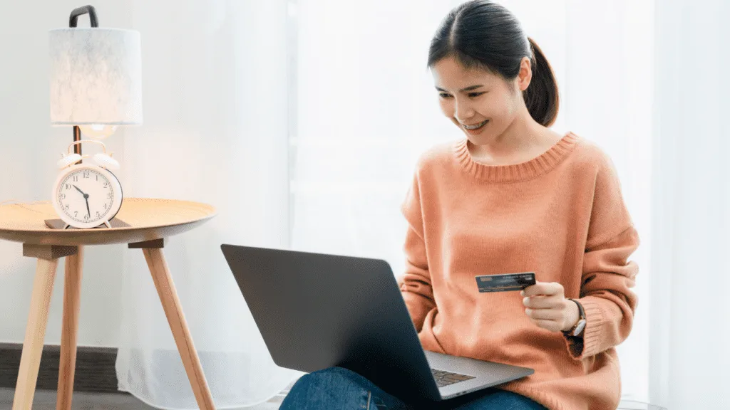 Woman with credit card and computer